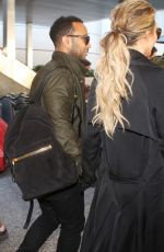 Pregnant CHRISSY TEIGEN at LAX Airport in Los Angeles 01/01/2016