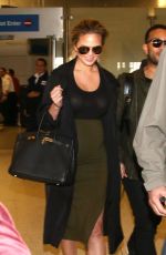 Pregnant CHRISSY TEIGEN at LAX Airport in Los Angeles 01/01/2016