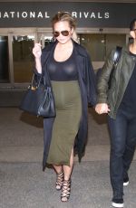 Pregnant CHRISSY TEIGEN at LAX Airport in Los Angeles 01/01/2016