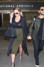 Pregnant CHRISSY TEIGEN at LAX Airport in Los Angeles 01/01/2016