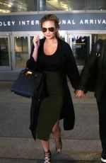Pregnant CHRISSY TEIGEN at LAX Airport in Los Angeles 01/01/2016