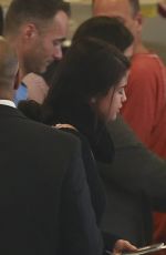 SELENA GOMEZ Boarding a Flight at LAX Airport 01/20/2016