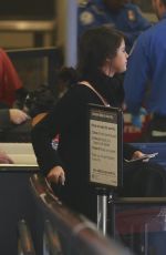 SELENA GOMEZ Boarding a Flight at LAX Airport 01/20/2016