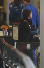 SELENA GOMEZ Boarding a Flight at LAX Airport 01/20/2016