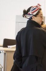 CARA DELEVINGNE and ANNIE CLARK at Charles De Gaulle Airport in Paris 02/20/2016