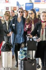 CARA DELEVINGNE and ANNIE CLARK at Charles De Gaulle Airport in Paris 02/20/2016