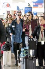 CARA DELEVINGNE and ANNIE CLARK at Charles De Gaulle Airport in Paris 02/20/2016
