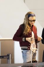 CARA DELEVINGNE and ANNIE CLARK at Charles De Gaulle Airport in Paris 02/20/2016