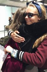 CARA DELEVINGNE and ANNIE CLARK at Charles-De-Gaulle Airport in Paris 02/28/2016