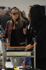 CARA DELEVINGNE and ANNIE CLARK at Charles-De-Gaulle Airport in Paris 02/28/2016
