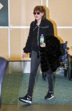 DAKOTA JOHNSON Arrives at Airport in Vancouver 02/15/2016