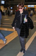 DAKOTA JOHNSON Arrives at Airport in Vancouver 02/15/2016