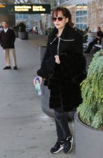 DAKOTA JOHNSON Arrives at Airport in Vancouver 02/15/2016