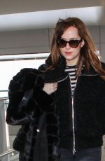 DAKOTA JOHNSON at Heathrow Airport in London 02/15/2016