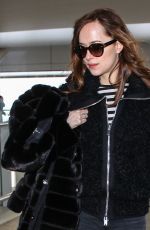 DAKOTA JOHNSON at Heathrow Airport in London 02/15/2016