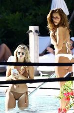 DEVIN BRUGMAN and NATASHA OAKLEY in Bikinis at a Pool in Miami 02/07/2016