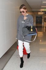 HAILEY BALDWIN at Los Angeles International Airport 02/19/2016