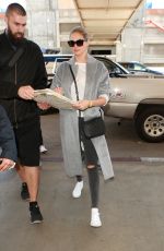 KATE UPTON Arrives at LAX Airport in Los Angeles 02/03/2016