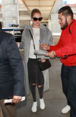 KATE UPTON Arrives at LAX Airport in Los Angeles 02/03/2016