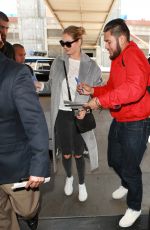 KATE UPTON Arrives at LAX Airport in Los Angeles 02/03/2016