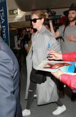 KATE UPTON Arrives at LAX Airport in Los Angeles 02/03/2016