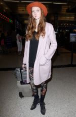 LILY COLE at Los Angeles International Airport 02/26/2016