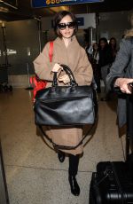LILY COLLINS Arrives at Los Angeles International Airport 02/19/2016