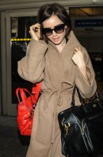 LILY COLLINS Arrives at Los Angeles International Airport 02/19/2016