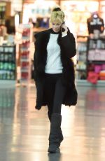 MELANIE GRIFFITH at JFK Airport in New York 02/02/2016
