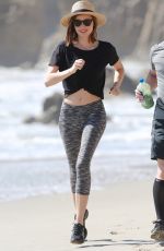 MIRANDA KERR Out Jogging at a Beach in Malibu 02/24/2016