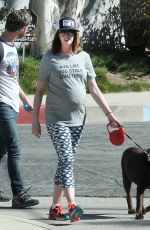 Pregnant ANNE HATHAWAY Walks Her Dog Out in Los Angeles 02/14/2016