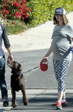Pregnant ANNE HATHAWAY Walks Her Dog Out in Los Angeles 02/14/2016