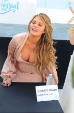 Pregnant CHRISSY TEIGEN at SI Swimsuit 2016 Swim Beach in Miami 02/17/2016