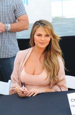 Pregnant CHRISSY TEIGEN at SI Swimsuit 2016 Swim Beach in Miami 02/17/2016