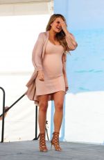Pregnant CHRISSY TEIGEN at SI Swimsuit 2016 Swim Beach in Miami 02/17/2016