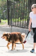 AMANDA SEYFRIED Walks Her Dog Out in Los Angeles 03/19/2016