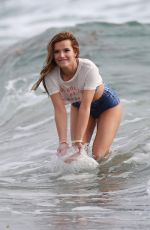 BELLA THORNE in Bikini on the Set of a Photoshoot at a Beach in Malibu 03/03/2016