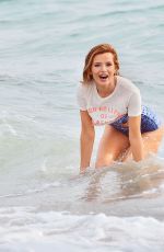 BELLA THORNE in Bikini on the Set of a Photoshoot at a Beach in Malibu 03/03/2016