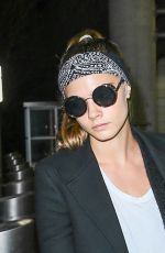 CARA DELEVINGNE at JFK Airport in New York 03/23/2016
