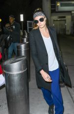 CARA DELEVINGNE at JFK Airport in New York 03/23/2016