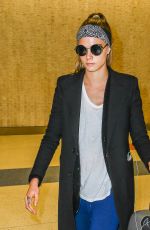CARA DELEVINGNE at JFK Airport in New York 03/23/2016