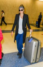 CARA DELEVINGNE at JFK Airport in New York 03/23/2016