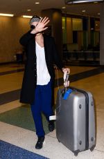 CARA DELEVINGNE at JFK Airport in New York 03/23/2016