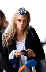 CARA DELEVINGNE at Orly Airport in Paris 03/23/2016