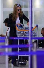 CARA DELEVINGNE at Orly Airport in Paris 03/23/2016