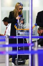 CARA DELEVINGNE at Orly Airport in Paris 03/23/2016
