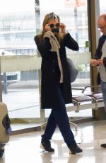 CARA DELEVINGNE at Orly Airport in Paris 03/23/2016