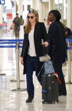 CARA DELEVINGNE at Orly Airport in Paris 03/23/2016