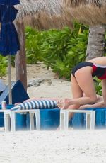 CATHERINE ZETA JONES in Swimsuit on the Beach in Cancun 03/23/2016