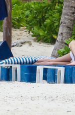 CATHERINE ZETA JONES in Swimsuit on the Beach in Cancun 03/23/2016